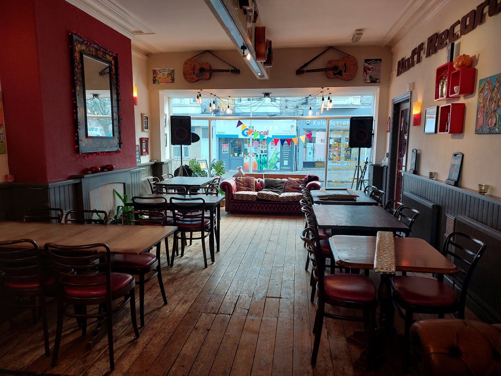 Inside Mojos Music Cafe — guitars on the walls